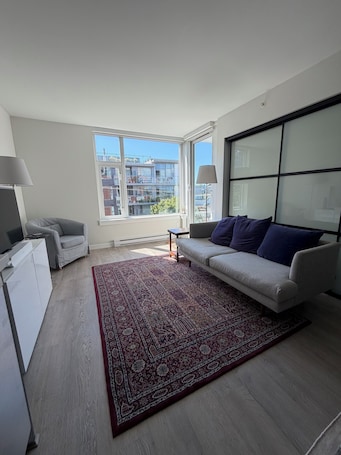 Living area. Bright 1BR + DEN in Mt Pleasant · 9 min to BC Place