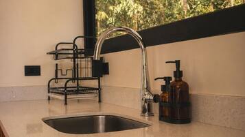 Full-size fridge, microwave, stovetop, cookware/dishes/utensils