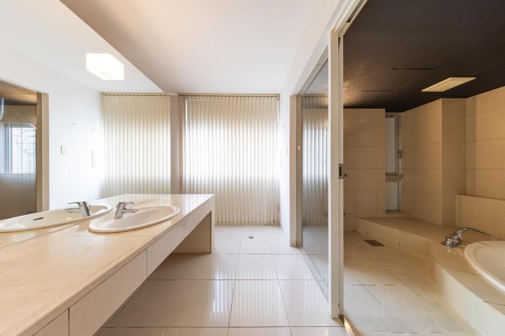 Deluxe Quadruple Room, Non Smoking | Bathroom | Separate tub and shower, hair dryer, slippers, towels