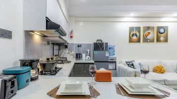 Deluxe Apartment, Balcony, City View | Private kitchen | Full-sized fridge, microwave, cookware/dishes/utensils