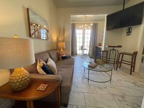 Premium Condo, 1 Bedroom | Living room | 50-inch Smart TV with digital channels - Stylish Studios in Galveston (Galveston)
