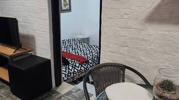 Departamento, 1 habitación, vista al jardín | Interior