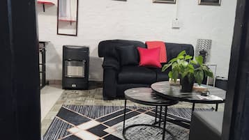 Appartement, 1 chambre, vue jardin | Coin séjour | Livres