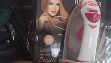 A hairdryer and its packaging on a table.