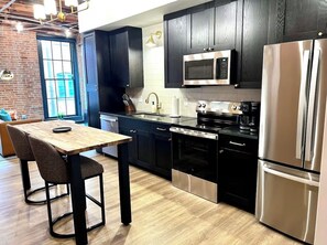 Private kitchen - Brick & Bed - Cheery Riverfront Loft Walk to Arch (St. Louis)