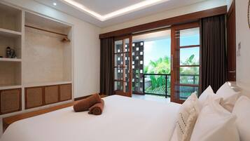 A hotel room with a large bed, a wardrobe, a balcony with a view, and a ceiling light.