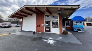 A U-Haul rental office with a blue ice cream machine outside.