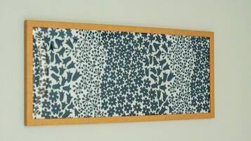 A framed artwork with a complex pattern.