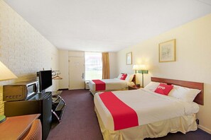 A hotel room with two beds, a TV, a desk, and a window with curtains. - 2 Queen Bed|Doswell VA (Doswell VA)