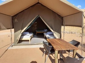A tent with two beds, a table, and chairs. - Camp Gecko (Solitaire)