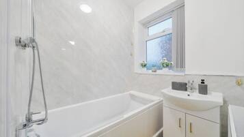 Separate tub and shower, deep soaking tub, towels