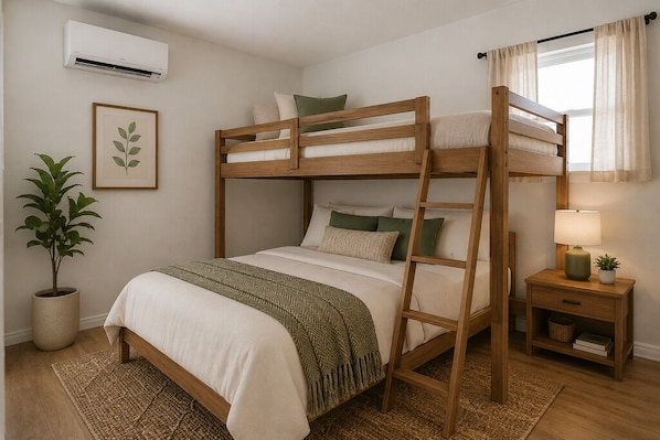 A bunk bed room with a bedside table, a lamp, a potted plant, and a framed picture on the wall. - Spacious 2-bedroom coastal retreat. Near Surfside Beach and Fishing (Oyster Creek)