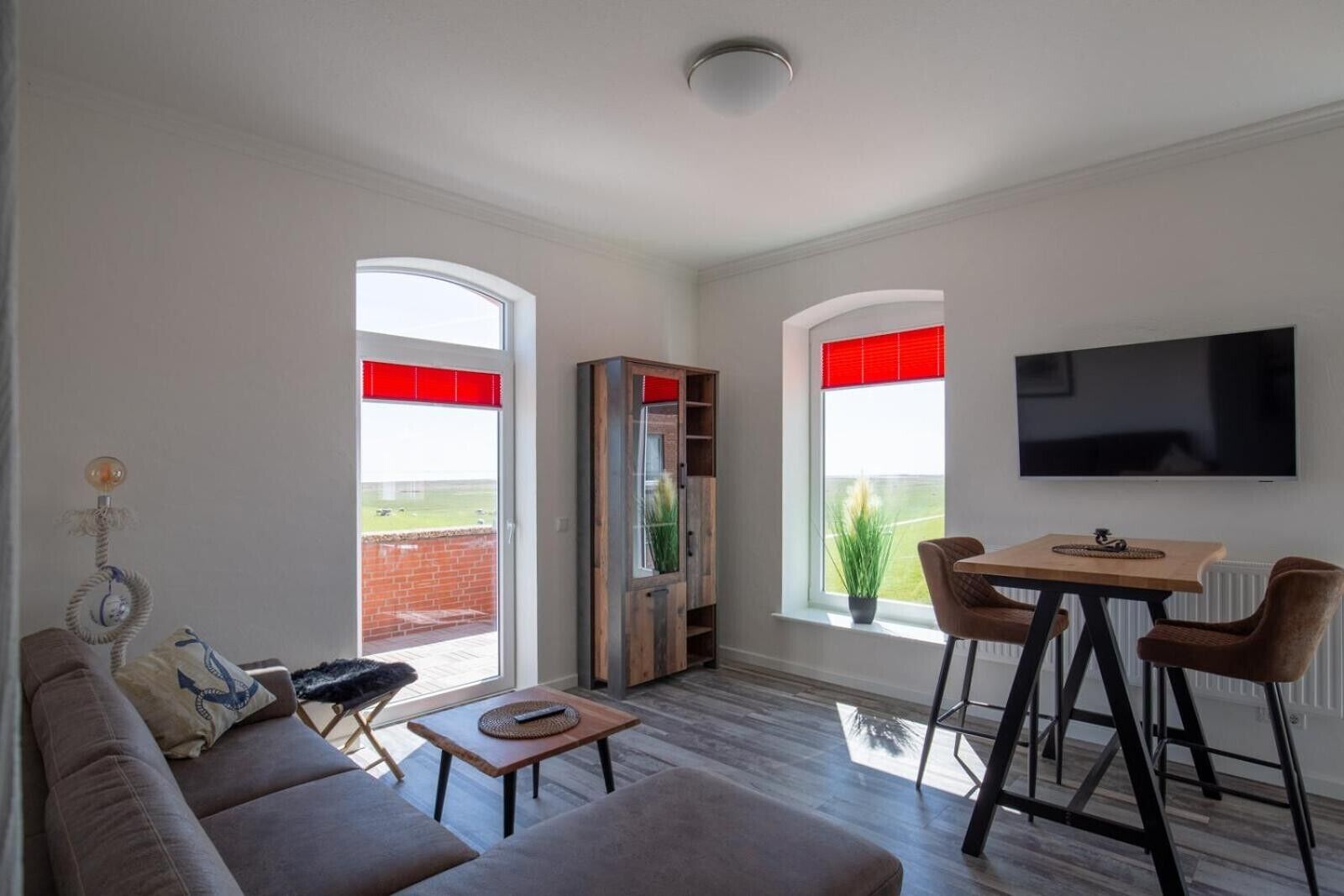 Living area. Apartment 'Ankerplatz Über Dem Hafen - Pub' with Sea View, Balcony and Wi-Fi