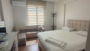 Desk, laptop workspace, free WiFi, bed sheets