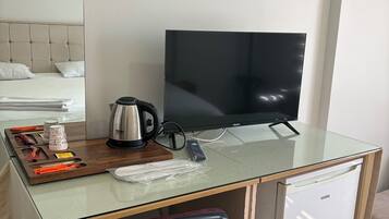 Desk, laptop workspace, free WiFi, bed sheets