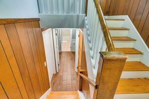 A wooden staircase with a handrail, leading to a landing with a door. - 15 Mi to Gillette Stadium! South Easton Apartment (South Easton)