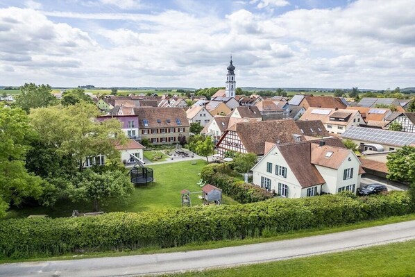 A village with traditional houses, a church, and a road. - Farm in Colmberg with swimming pool (Colmberg)