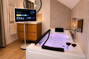 Jetted bath, hair dryer, towels, soap