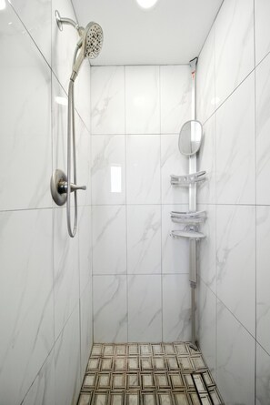 Shower, towels, soap, toilet paper