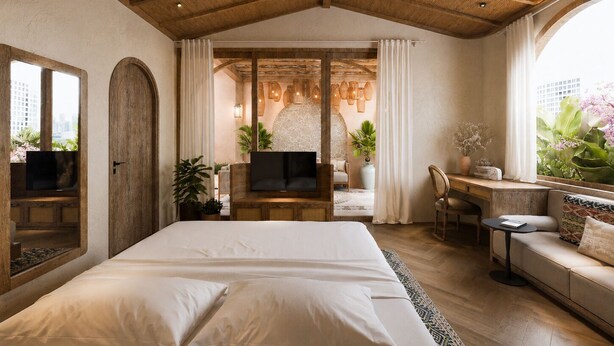 Un dormitorio moderno con una cama grande, televisión, escritorio y zona de estar.