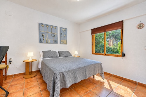 Holiday Home 'Cova Negra Nature' with Mountain Views, Shared Pool, and Air Conditioning
