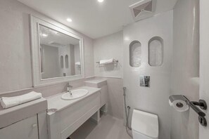 A modern bathroom with a large mirror, two sinks, a shower, and a toilet. - Mabat Jasmine Greek Villa 4BR 583 Villa6 (Jeddah)