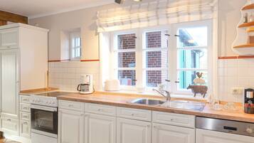 Coffee/tea maker, fridge, microwave, oven