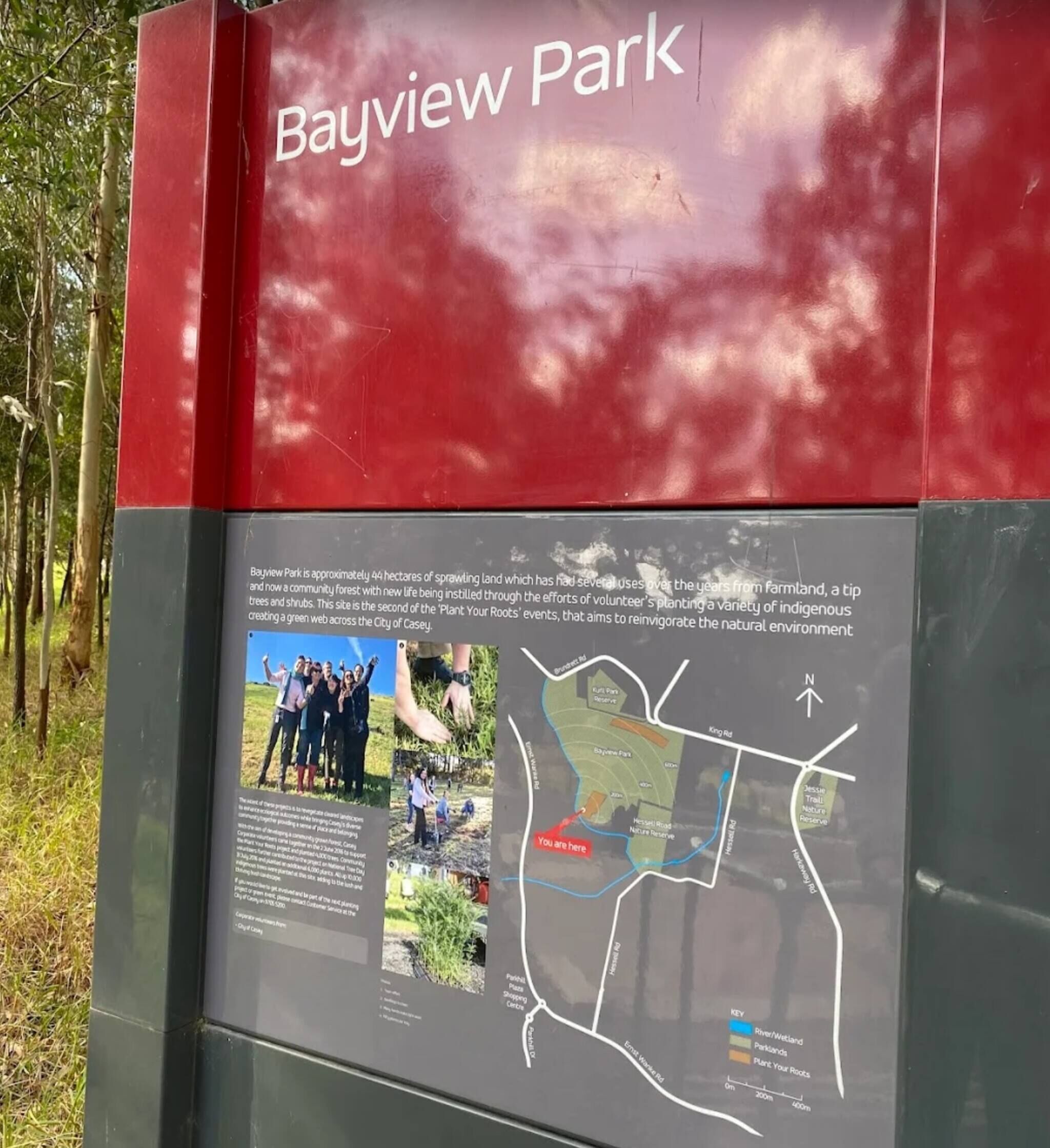 A red sign with 'Bayview Park' and a map indicating park boundaries.