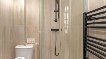Shower, hair dryer, towels, shampoo