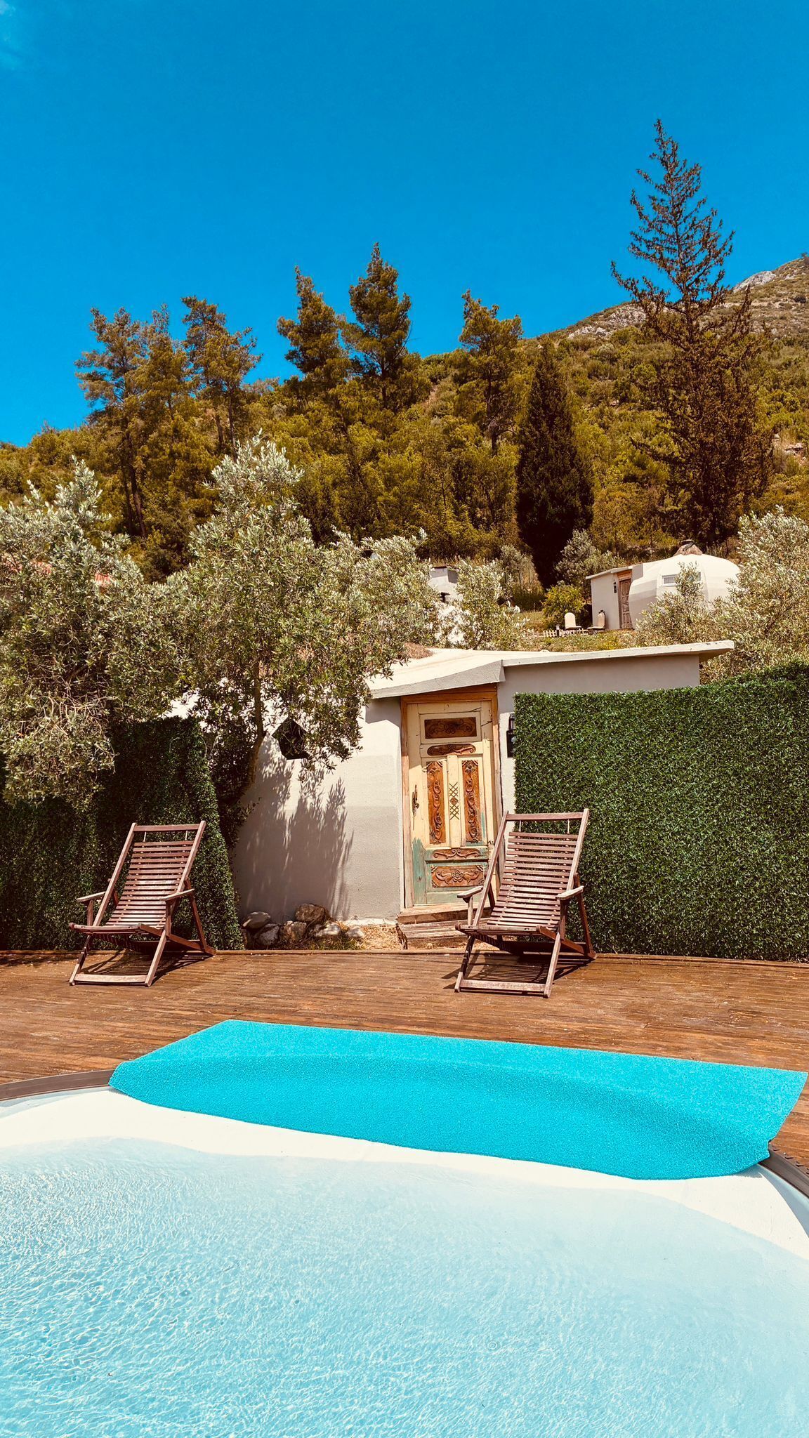 Seasonal outdoor pool, open 8:00 AM to 7:00 PM, pool umbrellas