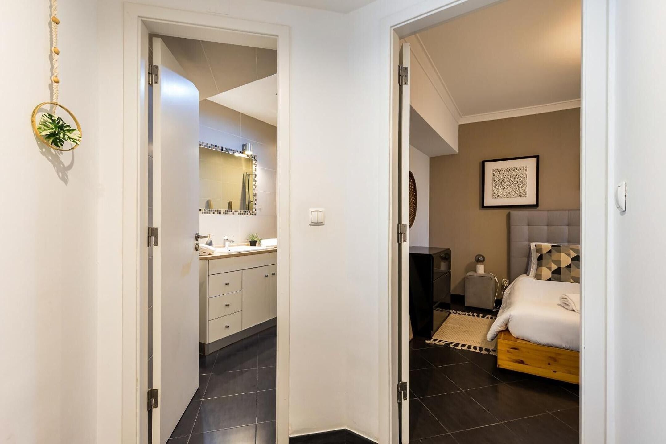 A bedroom with a bed, bedside table, and a headboard.