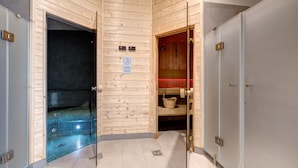 A wooden interior with a sauna, a tiled floor, and a visible door leading to another room. - Live & Travel Apartments Waterlane  (Gdańsk)