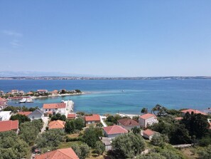 A coastal town with houses, a marina, and a clear view of the sea. - Groundfloor Apartment Landula (Preko)