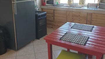 Basic Cottage, Patio, Sea View | Private kitchen