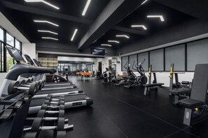 A modern gym with treadmills, elliptical machines, and weightlifting equipment. - Serene 2-bedroom apartment in Nairobi perfect for your stay (Nairobi)