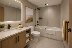 Ein modernes Badezimmer mit Waschbecken, Toilette und Badewanne.
