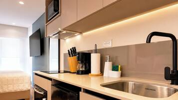 Condo, City View | Private kitchen | Microwave, oven, stovetop, cookware/dishes/utensils