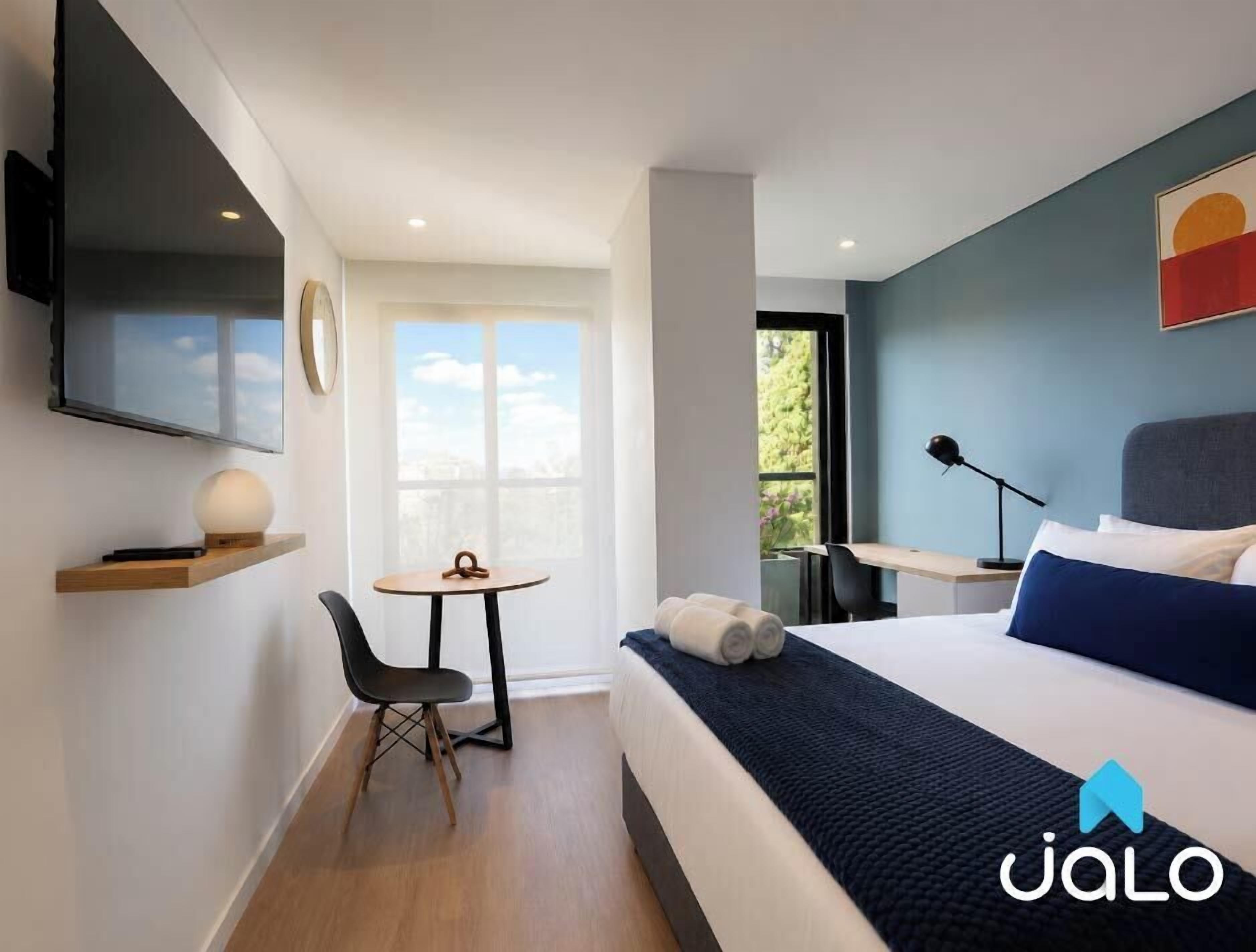 Junior Apartment, City View | Premium bedding, in-room safe, laptop workspace, blackout curtains