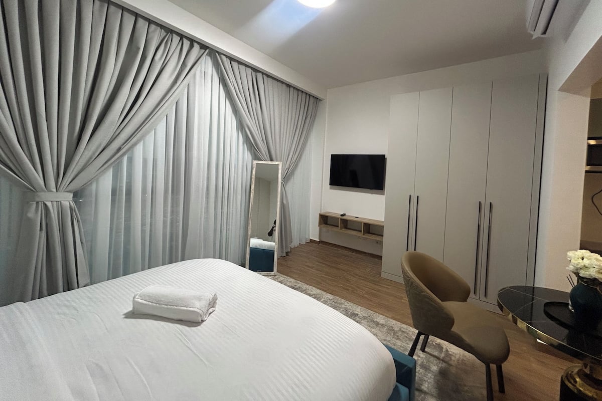 Premium bedding, down duvets, desk, laptop workspace