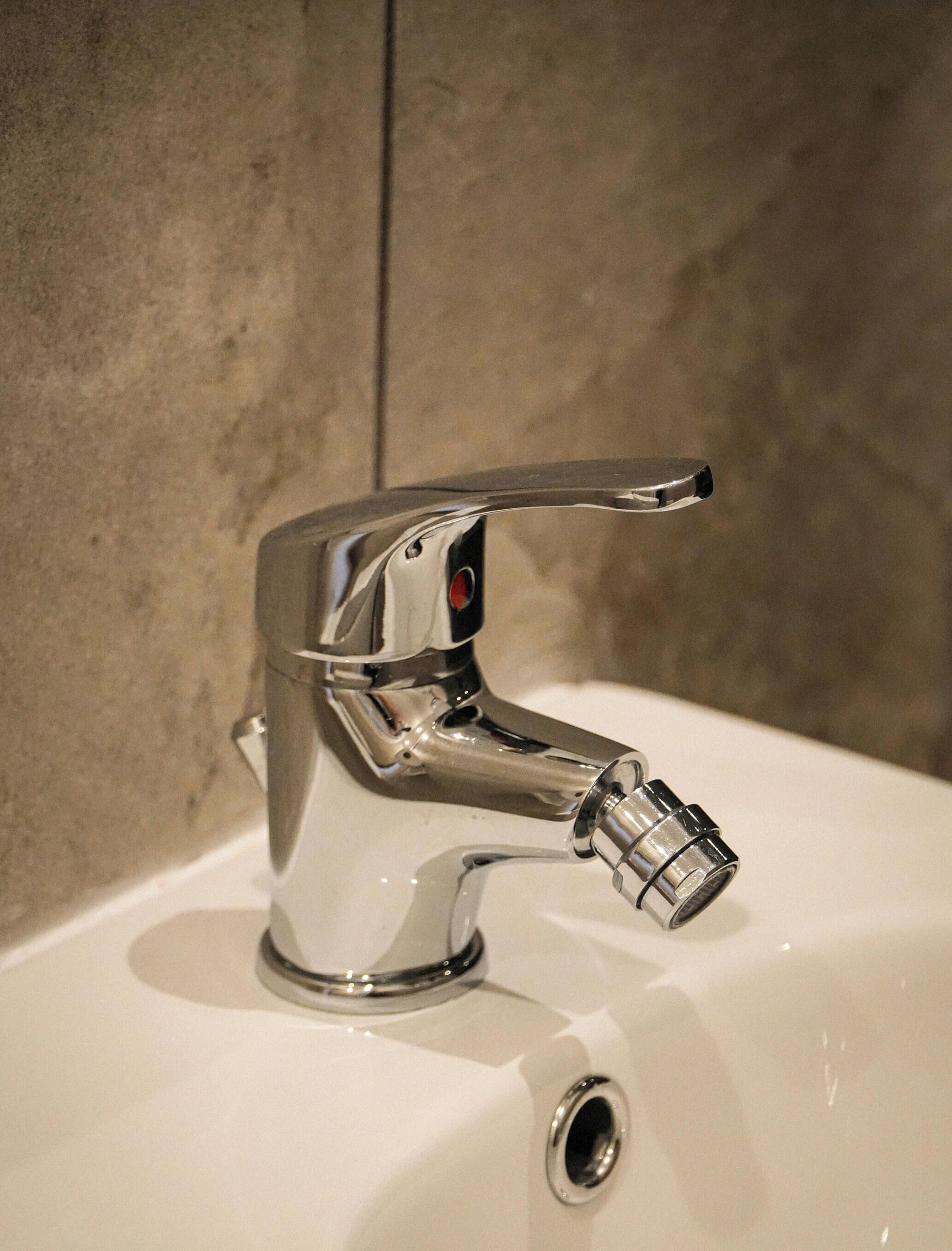 A bathroom sink with a chrome faucet and a single-handle design.