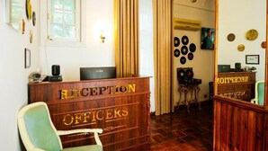 A reception desk with a sign reading 'RECEPTION OFFICERS HOTEL.' - Officers Boutique (Samarkand)