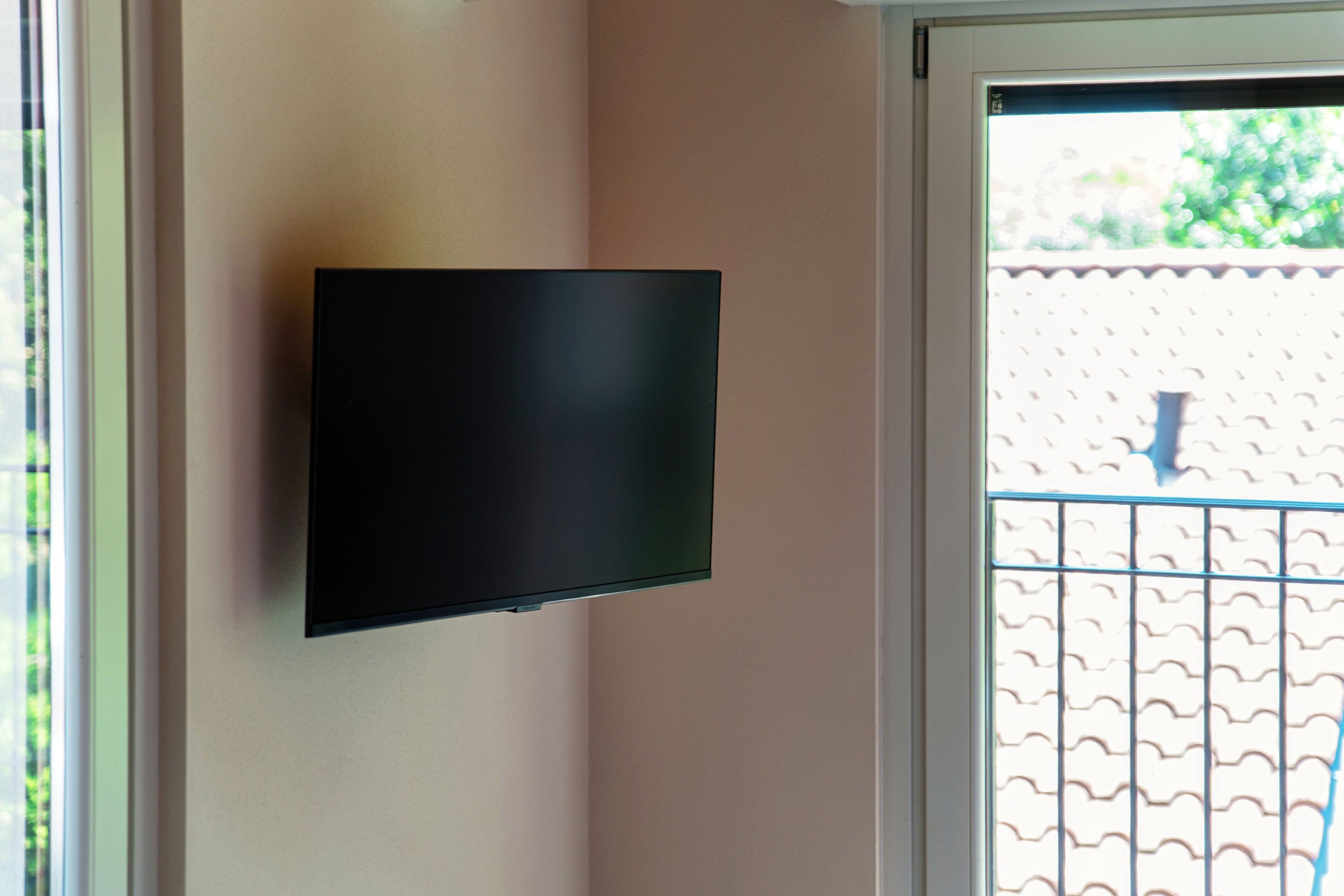 A flat-screen TV mounted on a wall.