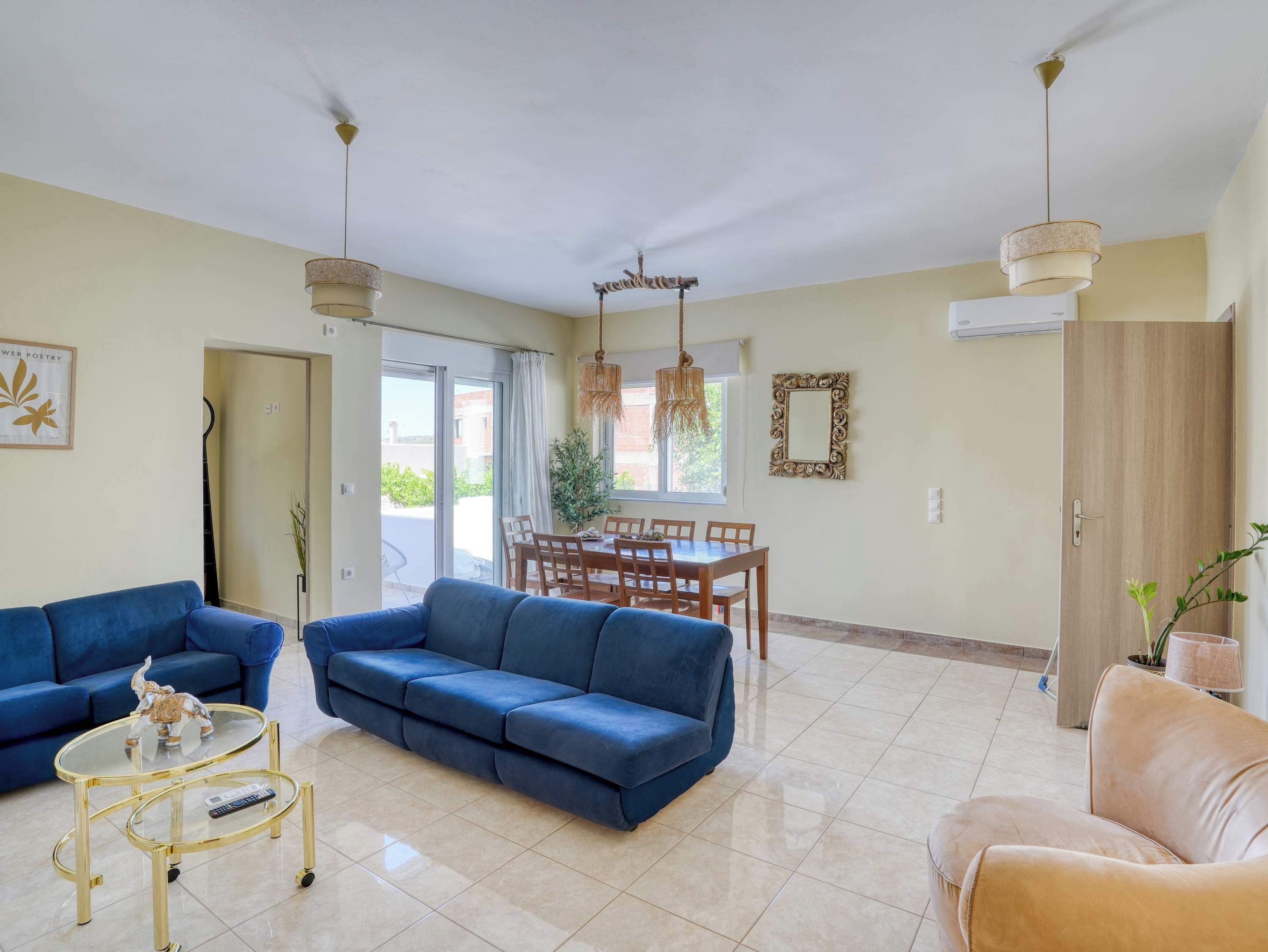 The spacious open plan living area brings together comfortable seating, natural light, and plenty of room to relax after a day exploring western Kos.