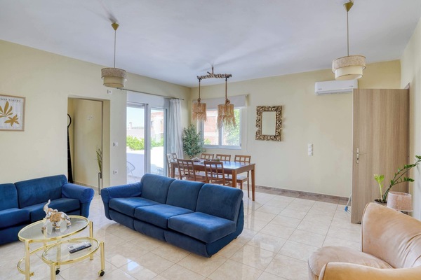 The spacious open plan living area brings together comfortable seating, natural light, and plenty of room to relax after a day exploring western Kos.