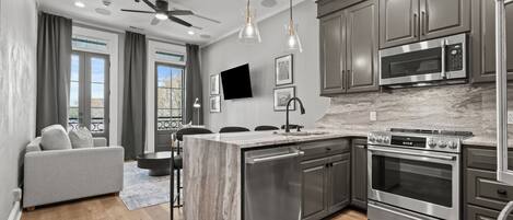 Luxury Apartment | Private kitchen | Full-size fridge, microwave, oven, stovetop
