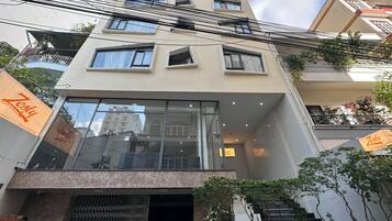 Deluxe Triple Room, City View | Exterior detail