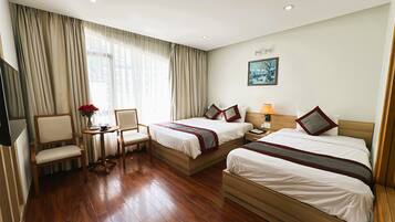 Deluxe Triple Room, City View | Desk, blackout drapes, free WiFi