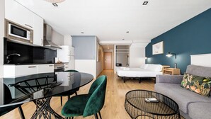 A modern apartment with a kitchen, dining area, and living room. - Sicilia-1602 - Studio Apartment, Sleeps 2 (Barcelona)