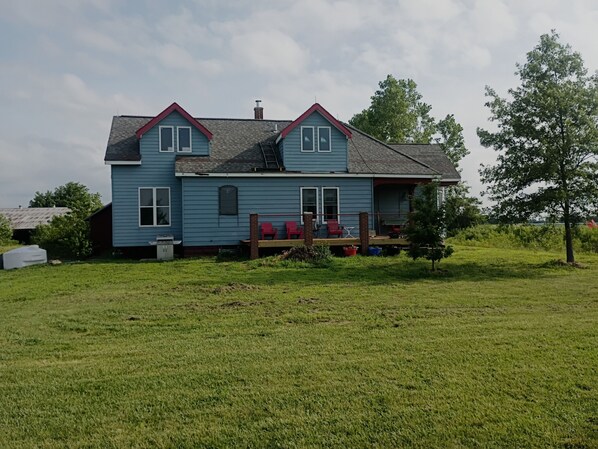 A two-story house with a porch, a chimney, and a grassy yard. - The Patriot on old Route 66 40 minutes from St Louis Mo. or Springfield, Il (Staunton)