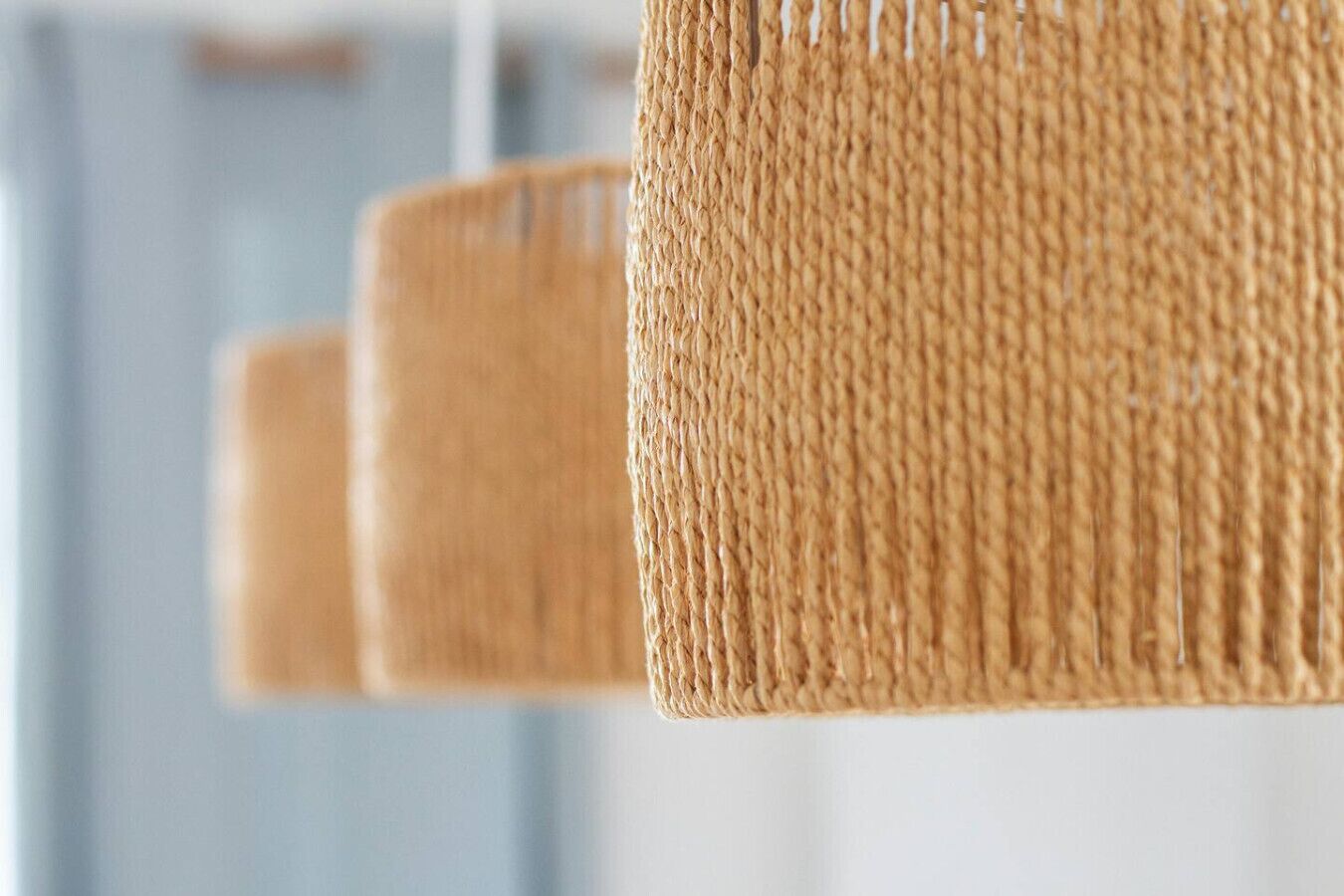 A close-up of a woven basket-like structure, likely a part of a room's decor.